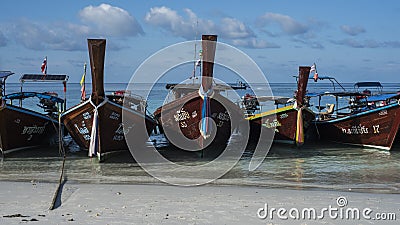 Fishing wooden rowing boats are parked on the beach on Koh Lipe, Thailand. Editorial Stock Photo