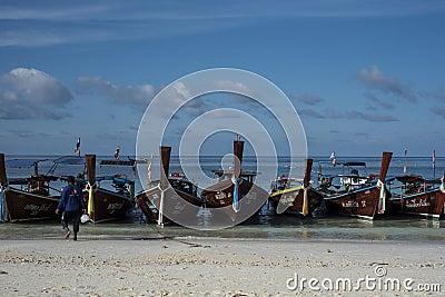 Fishing wooden rowing boats are parked on the beach on Koh Lipe, Thailand. Editorial Stock Photo