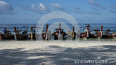 Fishing wooden rowing boats are parked on the beach on Koh Lipe, Thailand. Editorial Stock Photo