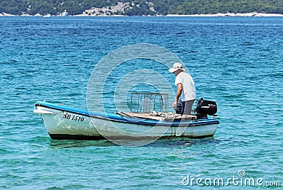 Men in boat fishing, Adriatic sea, Croatia Editorial Stock Photo