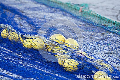 Fishnet trawl rope putdoor in summer at harbour Stock Photo