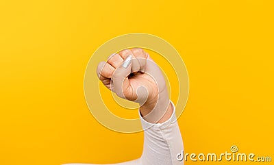 girl with a heart to fight with everything. self confidence determination and decisiveness hands and yellow background Stock Photo