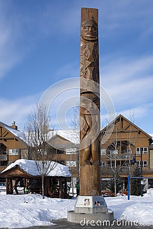 Olympic lightning welcome figure wooden carving in Whistler village Editorial Stock Photo