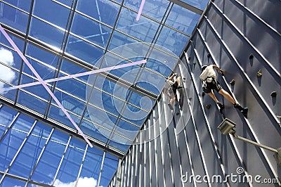 Fit couple rock climbing Stock Photo