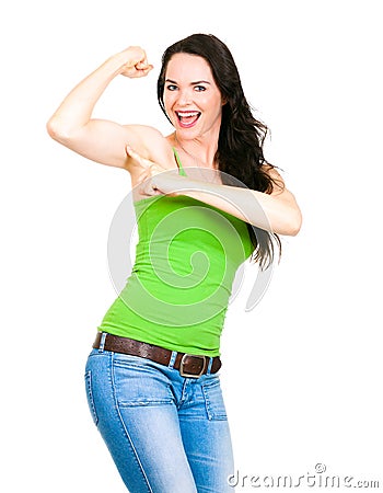 A fit happy woman pointing to flexed muscle Stock Photo