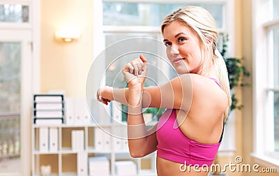 Fit healthy young woman doing stretches Stock Photo