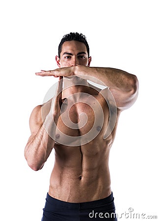 Fit muscular man gesturing time out sign Stock Photo
