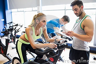 Fit people in a spin class Stock Photo