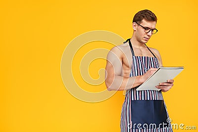 Fit man in apron Stock Photo