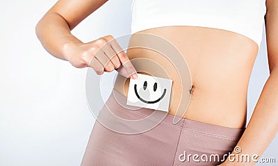 Fit Slim Body Holding White Card With Happy .Smiley Face In Hands Good Digestion Concepts Stock Photo