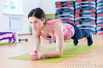 Fit sportive woman doing plank core exercise training back and press muscles concept gym sport sportsman fitness workout Stock Photo