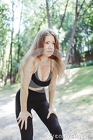 Fit sporty woman take breath at jogging workout Stock Photo
