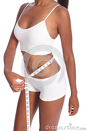 Fit torso of black woman checking diet weight loss Stock Photo