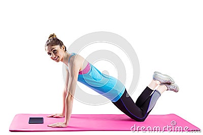 Fit woman doing press up on mat Stock Photo