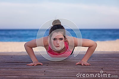 Fit woman doing push up or press up Stock Photo