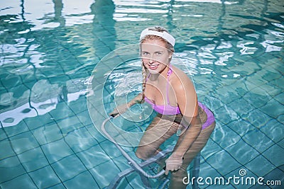 Fit woman doing underwater bike Stock Photo