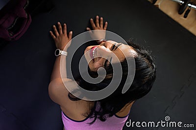 Fit woman doing yoga plank and smiling. Concept of young woman training at home Stock Photo