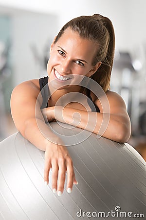 Fit Woman Holding a Pilates Ball Stock Photo