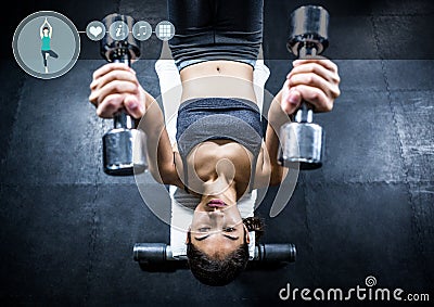 Fit woman perfroming flat bench exercise in gym against fitness interface i n background Stock Photo