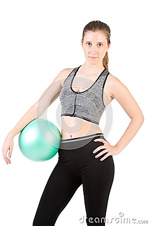 Fit Woman Standing Holding a Pilates Ball Stock Photo