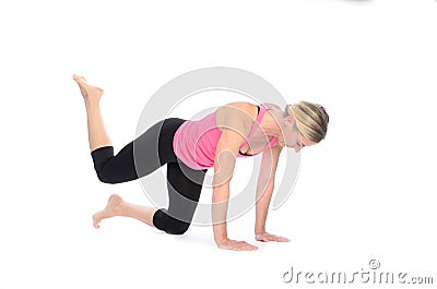 Fit woman strengthening her thigh muscles Stock Photo