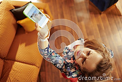 Fit woman trying to get better wifi signal on smartphone Stock Photo