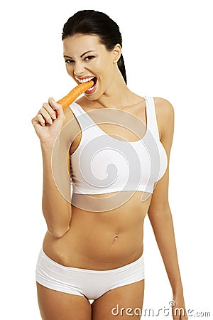 Fit young beautiful woman with carrot Editorial Stock Photo