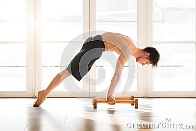 Fit young man doing a calisthenics planche pose Stock Photo