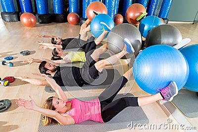 Fitball crunch training group core fitness at gym Stock Photo