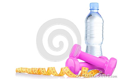 Fitnes symbols - pink dumbbells, a bottle of water and a towel. The concept of a healthy lifestyle Stock Photo