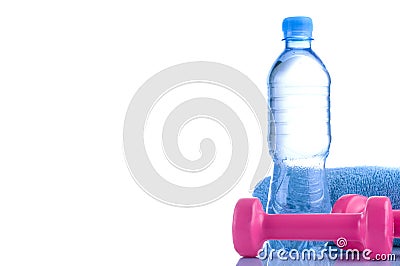 Fitnes symbols - Pink dumbbells, a bottle of water and a towel. The concept of a healthy lifestyle Stock Photo