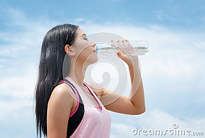 Athlete woman drinking water after work out exercising Stock Photo