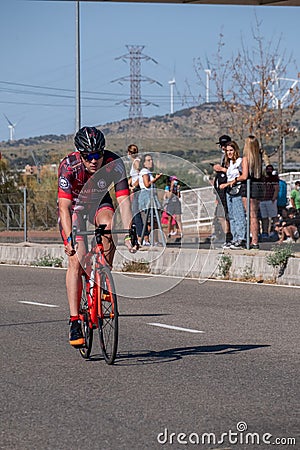 Fitness athletes pedaling their bikes during a national Triathlon, swimming, cycling and running events. Editorial Stock Photo