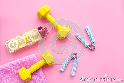 Fitness background with sport equipment for gym and home on pink background top view Stock Photo