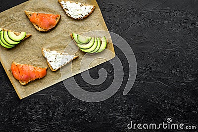 Fitness breskfast with homemade sandwiches on black background top view mockup Stock Photo