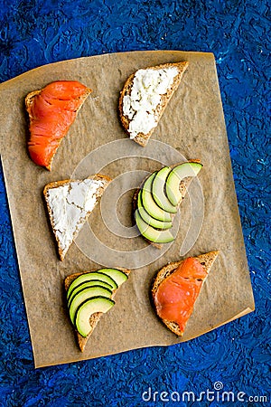 Fitness breskfast with homemade sandwiches on blue background top view mockup Stock Photo