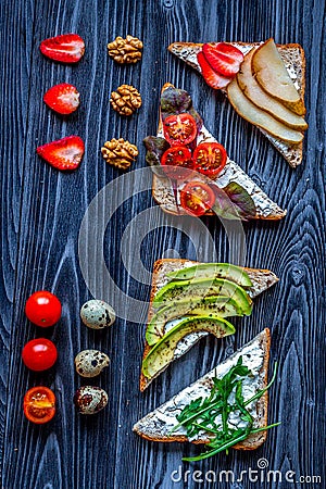 Fitness breskfast with homemade sandwiches dark table background top view Stock Photo