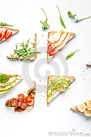 Fitness breskfast with homemade sandwiches white table background top view Stock Photo