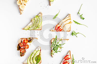 Fitness breskfast with homemade sandwiches white table background top view Stock Photo