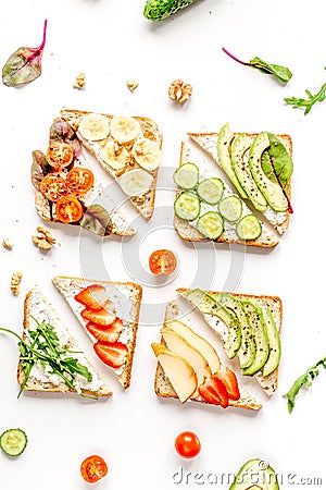 Fitness breskfast with homemade sandwiches white table background top view Stock Photo