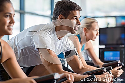 Fitness class biking at gym Stock Photo