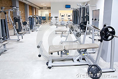 Fitness club gym with sport equipment interior Stock Photo