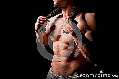 Fitness concept. Muscular and torso of young man having perfect abs, bicep and chest. Male hunk with athletic body. Stock Photo