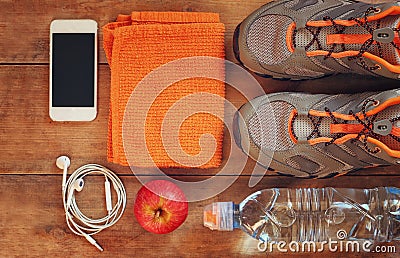 Fitness concept with sport footwear over wooden background. top view image Stock Photo