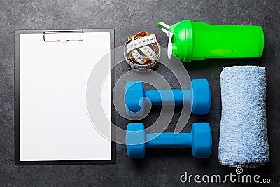 Fitness equipment and blank sheet for workout Stock Photo