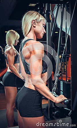 Fitness girl in black sport wear with perfect body Stock Photo