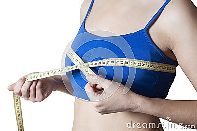 Fitness girl measured her breast Stock Photo