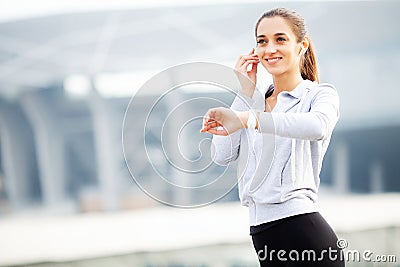 Fitness Girl. Portrait of a lovely young fitness girl listening music Stock Photo