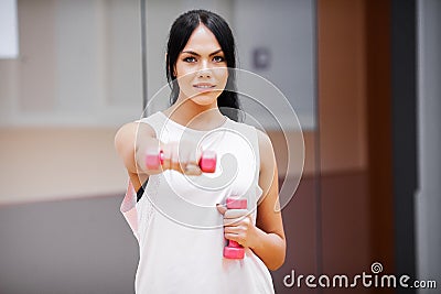 Fitness Girl. Sexy athletic girl working out in gym. Fitness woman doing exercise Stock Photo