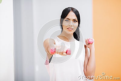 Fitness Girl. Sexy athletic girl working out in gym. Fitness woman doing exercise Stock Photo